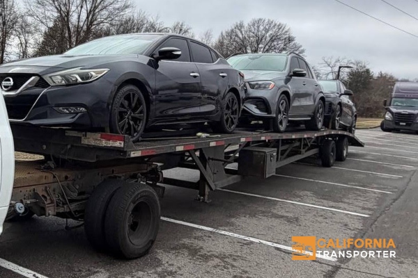 Shipping vehicles on a open trailer.