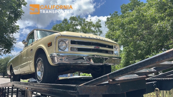 Hauling a Pickup truck on a open trailer.